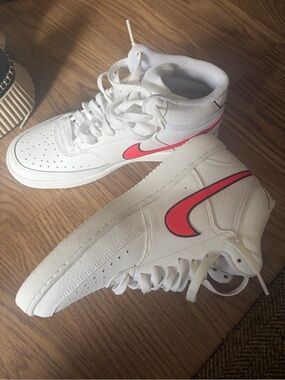 Nike Women’s White High-Top Sneakers with Pink Logo